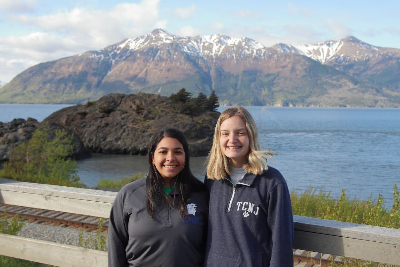 Students posing near Cook Inlet