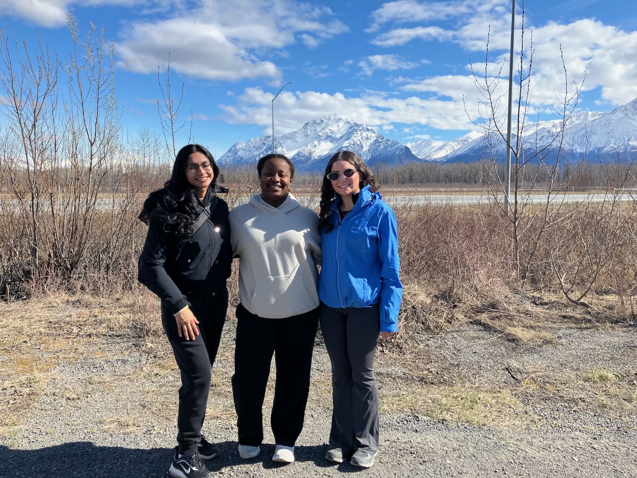 Students posing in front of Pioneer Peak