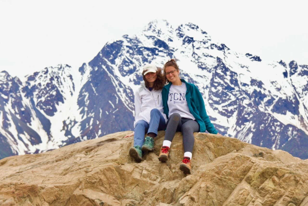 Students posing in front of Pioneer Peak